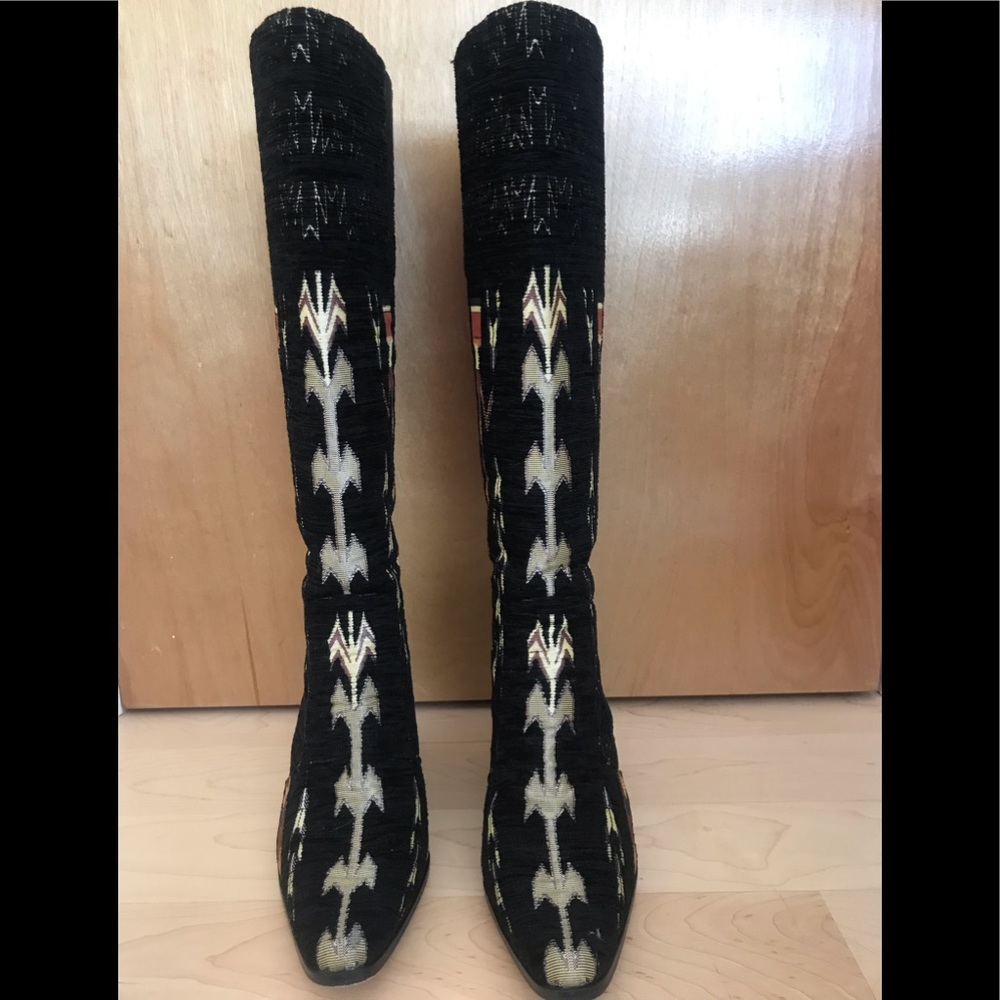 Black and white fabric knee high boots.